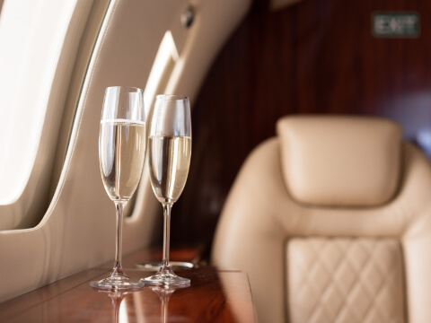 Two Champagne Glasses on private jet